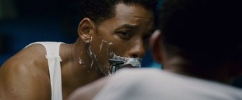 Movie still from “Seven Pounds” (2008), directed by Gabriele Muccino – A person shaving with a razor; Close Up shot, Over the shoulder angle