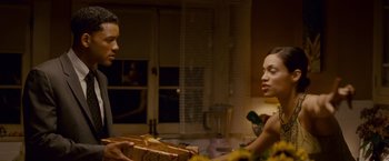 Movie still from “Seven Pounds” (2008), directed by Gabriele Muccino – A man and a woman sitting at a dinner table; Medium shot, Over the shoulder angle