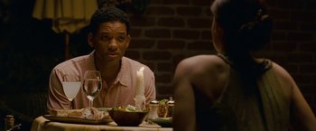Movie still from “Seven Pounds” (2008), directed by Gabriele Muccino – A man and a woman sitting at a dinner table; Close Up shot, Over the shoulder angle
