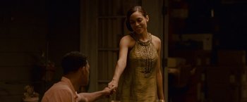 Movie still from “Seven Pounds” (2008), directed by Gabriele Muccino – A man and a woman holding hands in a room; Medium shot, Over the shoulder angle