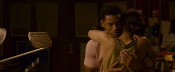 Movie still from “Seven Pounds” (2008), directed by Gabriele Muccino – A man and a woman hugging in a room; Medium shot, Over the shoulder angle