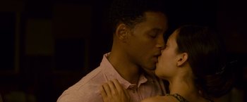 Movie still from “Seven Pounds” (2008), directed by Gabriele Muccino – A man and a woman are kissing in the dark; Close Up shot, Low angle