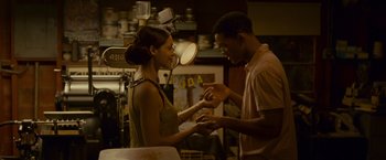 Movie still from “Seven Pounds” (2008), directed by Gabriele Muccino – A man and a woman exchanging a ring; Medium shot, Over the shoulder angle