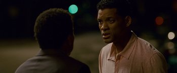 Movie still from “Seven Pounds” (2008), directed by Gabriele Muccino – Two men are standing in front of each other talking; Close Up shot, Over the shoulder angle