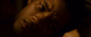 Movie still from “Seven Pounds” (2008), directed by Gabriele Muccino – A man's face in the dark; Extreme Close Up shot, Overhead angle