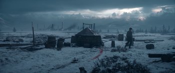 Movie still from “1899” (2022), created by Jantje Friese – An abandoned building in the middle of a snowy field; Extreme Wide shot, High angle