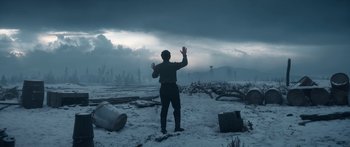 Movie still from “1899” (2022), created by Jantje Friese – A man standing in the middle of a snowy field; Extreme Wide shot, Low angle