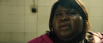 Movie still from “Seven Psychopaths” (2012), directed by Martin McDonagh – A person looking at the camera; Close Up shot, Low angle