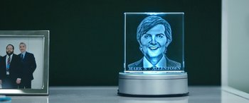 Movie still from “Severance” (2022), created by Dan Erickson – A picture of a person in a glass case; Extreme Close Up shot, High angle