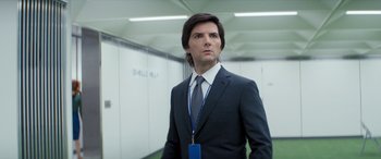 Movie still from “Severance” (2022), created by Dan Erickson – A man in a suit and a tie; Close Up shot, Over the shoulder angle