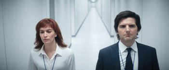 Movie still from “Severance” (2022), created by Dan Erickson – A man and a woman standing next to each other; Close Up shot, Low angle