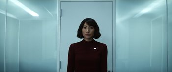 Movie still from “Severance” (2022), created by Dan Erickson – A woman standing in front of a white door; Close Up shot, Low angle