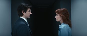 Movie still from “Severance” (2022), created by Dan Erickson – A man and a woman facing each other in a dark hallway; Close Up shot, Low angle