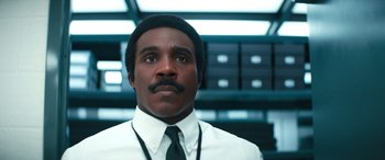 Movie still from “Severance” (2022), created by Dan Erickson – A man in a white dress shirt and black tie; Close Up shot, Low angle