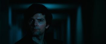 Movie still from “Severance” (2022), created by Dan Erickson – A person looking at the camera; Close Up shot, Over the shoulder angle