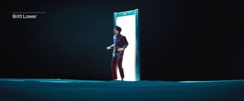 Movie still from “Severance” (2022), created by Dan Erickson – A man standing in front of an open door; Wide shot, Low angle