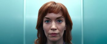 Movie still from “Severance” (2022), created by Dan Erickson – A person with red hair; Close Up shot, Low angle