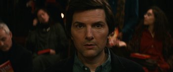Movie still from “Severance” (2022), created by Dan Erickson – A person wearing a jacket; Close Up shot, Over the shoulder angle
