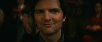 Movie still from “Severance” (2022), created by Dan Erickson – A man's face in a suit jacket; Close Up shot, Over the shoulder angle