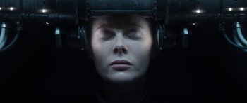 Movie still from “1899” (2022), created by Jantje Friese – A woman with her eyes closed in a dark room; Close Up shot, Overhead angle