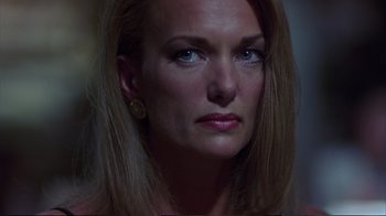 Movie still from “Sexy Beast” (2000), directed by Jonathan Glazer – A person with long blonde hair; Close Up shot, Low angle