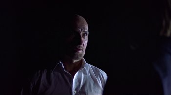 Movie still from “Sexy Beast” (2000), directed by Jonathan Glazer – A man with a bald head is looking into the distance; Close Up shot, Low angle