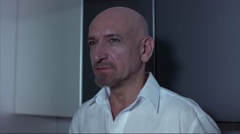 Movie still from “Sexy Beast” (2000), directed by Jonathan Glazer – A man with a bald head wearing a white shirt; Close Up shot, Low angle