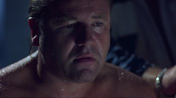Movie still from “Sexy Beast” (2000), directed by Jonathan Glazer – A man's face in the dark; Close Up shot, Low angle