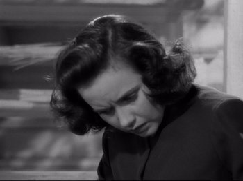 Movie still from “Shadow of a Doubt” (1943), directed by Alfred Hitchcock – An old photo of a woman looking down; Close Up shot, High angle