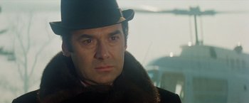 Movie still from “Shaft's Big Score!” (1972), directed by Gordon Parks – A person wearing a hat; Close Up shot, Over the shoulder angle