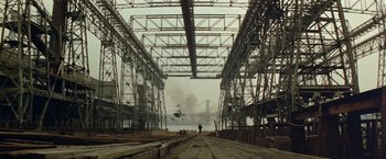 Movie still from “Shaft's Big Score!” (1972), directed by Gordon Parks – A helicopter is flying over a bridge in the distance; Extreme Wide shot, Low angle