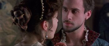Movie still from “Shakespeare in Love” (1998), directed by John Madden – A man and a woman looking into each others eyes; Close Up shot, Over the shoulder angle