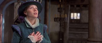 Movie still from “Shakespeare in Love” (1998), directed by John Madden – A woman in a green dress and a purple hat; Medium shot, Low angle