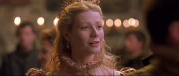 Movie still from “Shakespeare in Love” (1998), directed by John Madden – A person wearing a crown; Close Up shot, Over the shoulder angle