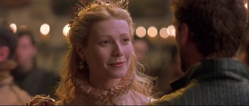 Movie still from “Shakespeare in Love” (1998), directed by John Madden – A person wearing a crown; Close Up shot, Over the shoulder angle