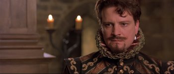 Movie still from “Shakespeare in Love” (1998), directed by John Madden – A person with a beard; Close Up shot, Over the shoulder angle