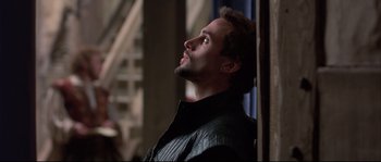 Movie still from “Shakespeare in Love” (1998), directed by John Madden – A person wearing a jacket looking up; Close Up shot, Low angle