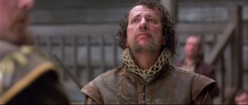 Movie still from “Shakespeare in Love” (1998), directed by John Madden – A person with a beard; Close Up shot, Low angle