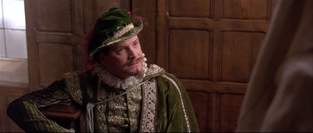 Movie still from “Shakespeare in Love” (1998), directed by John Madden – A person wearing a hat; Close Up shot, Over the shoulder angle