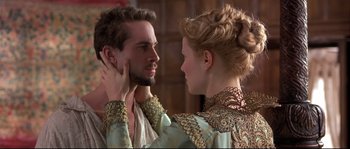 Movie still from “Shakespeare in Love” (1998), directed by John Madden – A man and a woman looking into each others eyes; Close Up shot, Over the shoulder angle