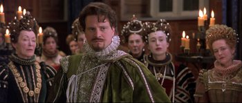 Movie still from “Shakespeare in Love” (1998), directed by John Madden – A group of people dressed in renaissance clothing; Close Up shot, Over the shoulder angle