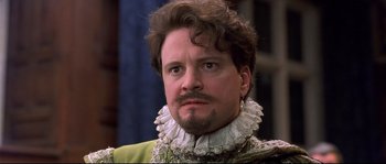 Movie still from “Shakespeare in Love” (1998), directed by John Madden – A person with a beard; Close Up shot, Over the shoulder angle