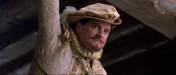 Movie still from “Shakespeare in Love” (1998), directed by John Madden – A person wearing a hat; Close Up shot, Low angle