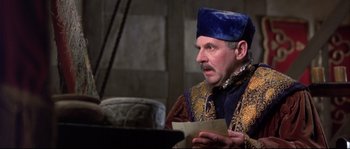 Movie still from “Shakespeare in Love” (1998), directed by John Madden – A man wearing a blue hat is holding a piece of paper in his hand; Close Up shot, Over the shoulder angle