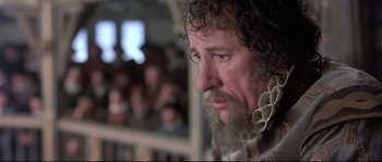 Movie still from “Shakespeare in Love” (1998), directed by John Madden – A person with a beard; Close Up shot, Over the shoulder angle