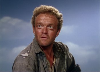 Movie still from “Shane” (1953), directed by George Stevens – A person wearing a shirt; Close Up shot, Low angle