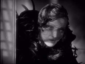 Movie still from “Shanghai Express” (1932), directed by Josef von Sternberg – A black and white photo of a woman wearing a veil; Close Up shot, Low angle