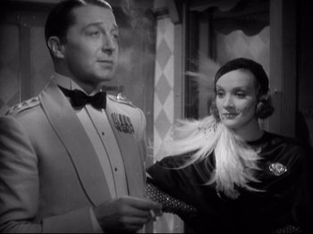 Movie still from “Shanghai Express” (1932), directed by Josef von Sternberg – A man and a woman standing next to each other; Medium shot, Low angle