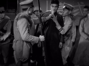Movie still from “Shanghai Express” (1932), directed by Josef von Sternberg – A group of men standing next to each other; Medium shot, High angle