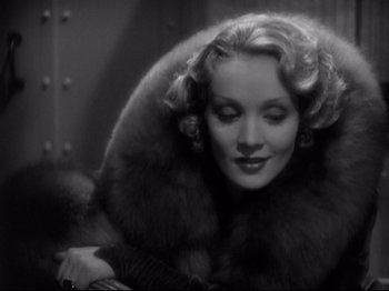 Movie still from “Shanghai Express” (1932), directed by Josef von Sternberg – An old photo of a woman in a fur coat; Close Up shot, Low angle